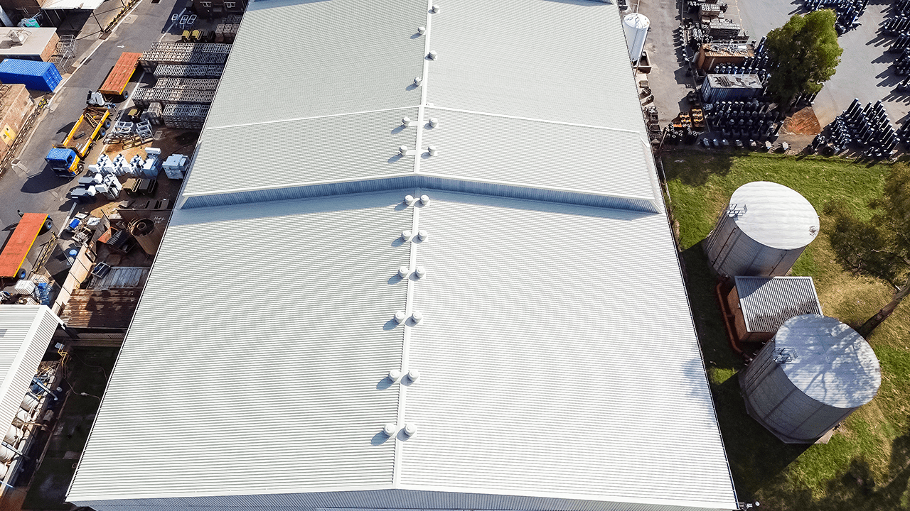 Industrial grade waterproofing being applied to Actoms high voltage facility roof for long term protection