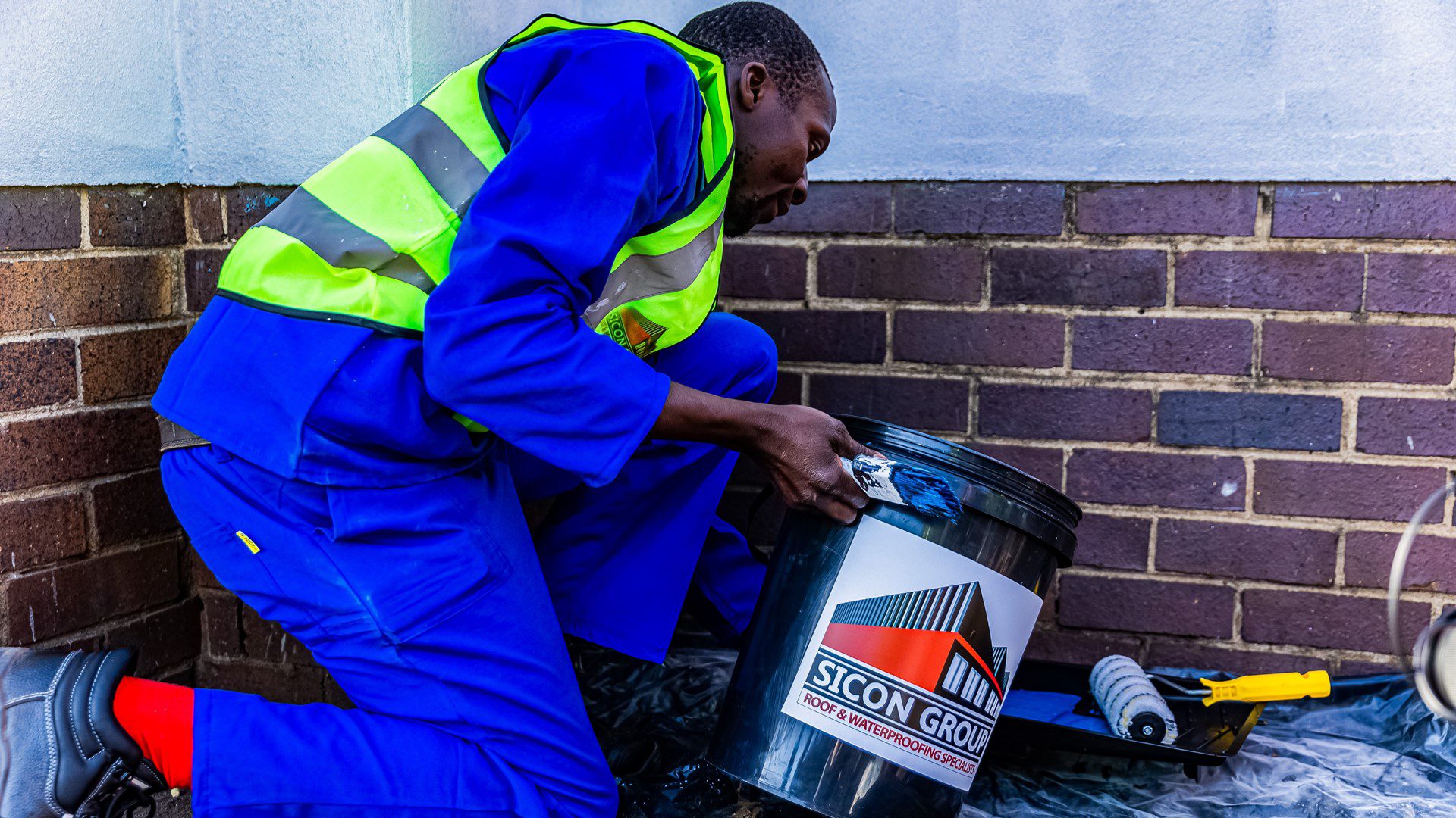 Staff preparing to repair roofing at Ambrose Primary School