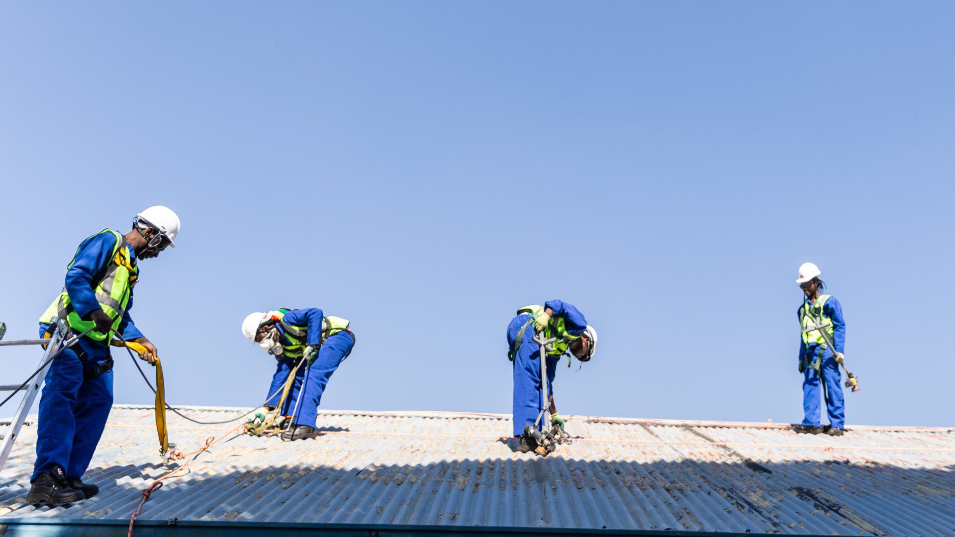 Workers interacting during CSI upliftment work.