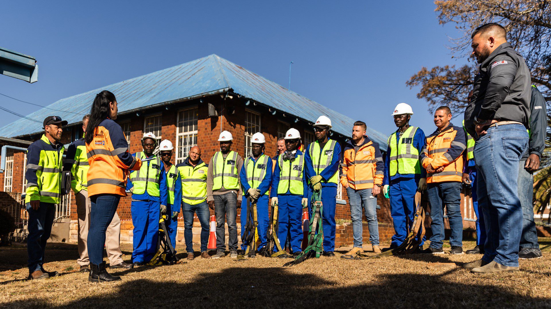 Employees restoring roofs at local school facilities