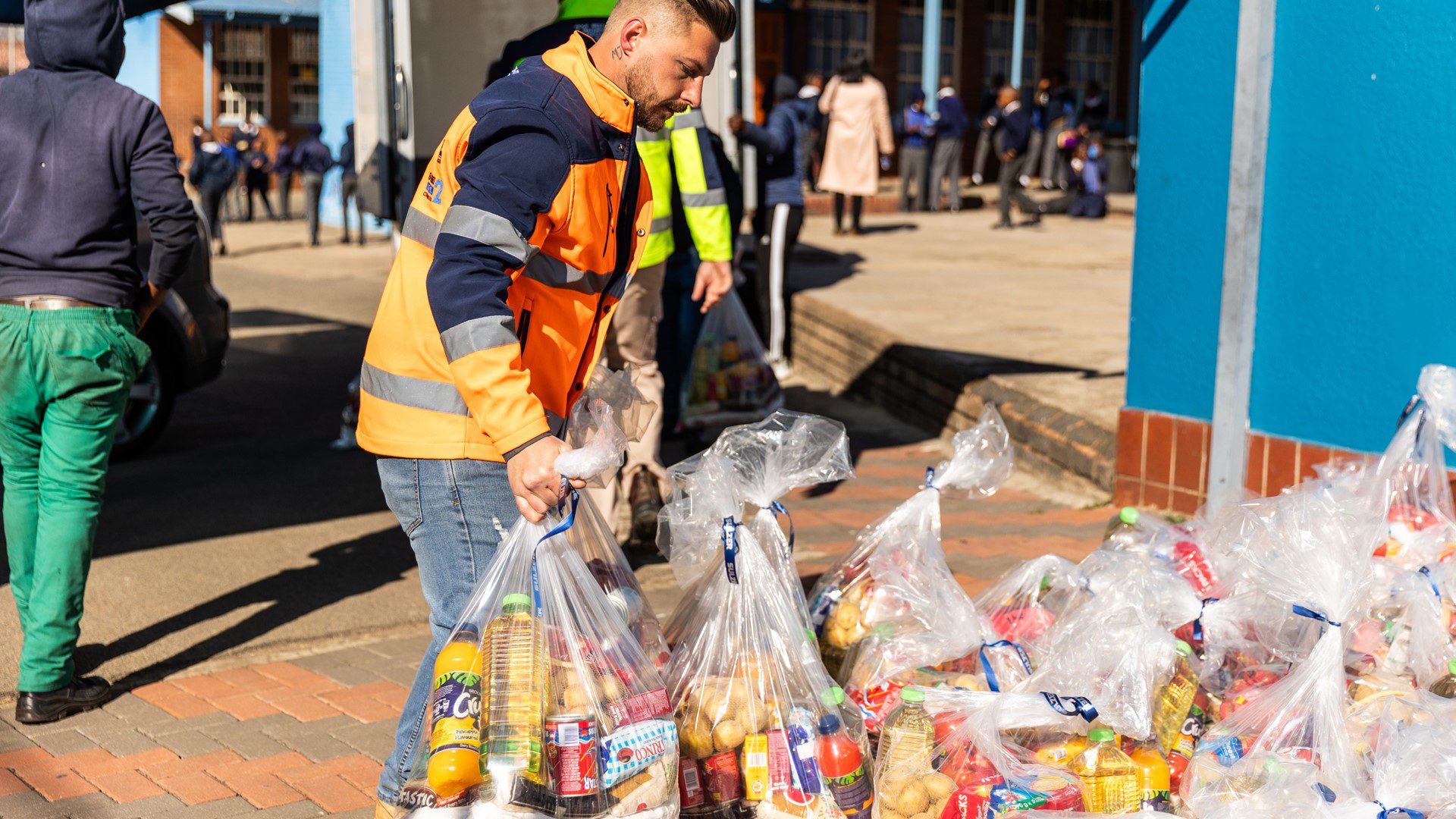 Staff preparing food parcels for donation to local families