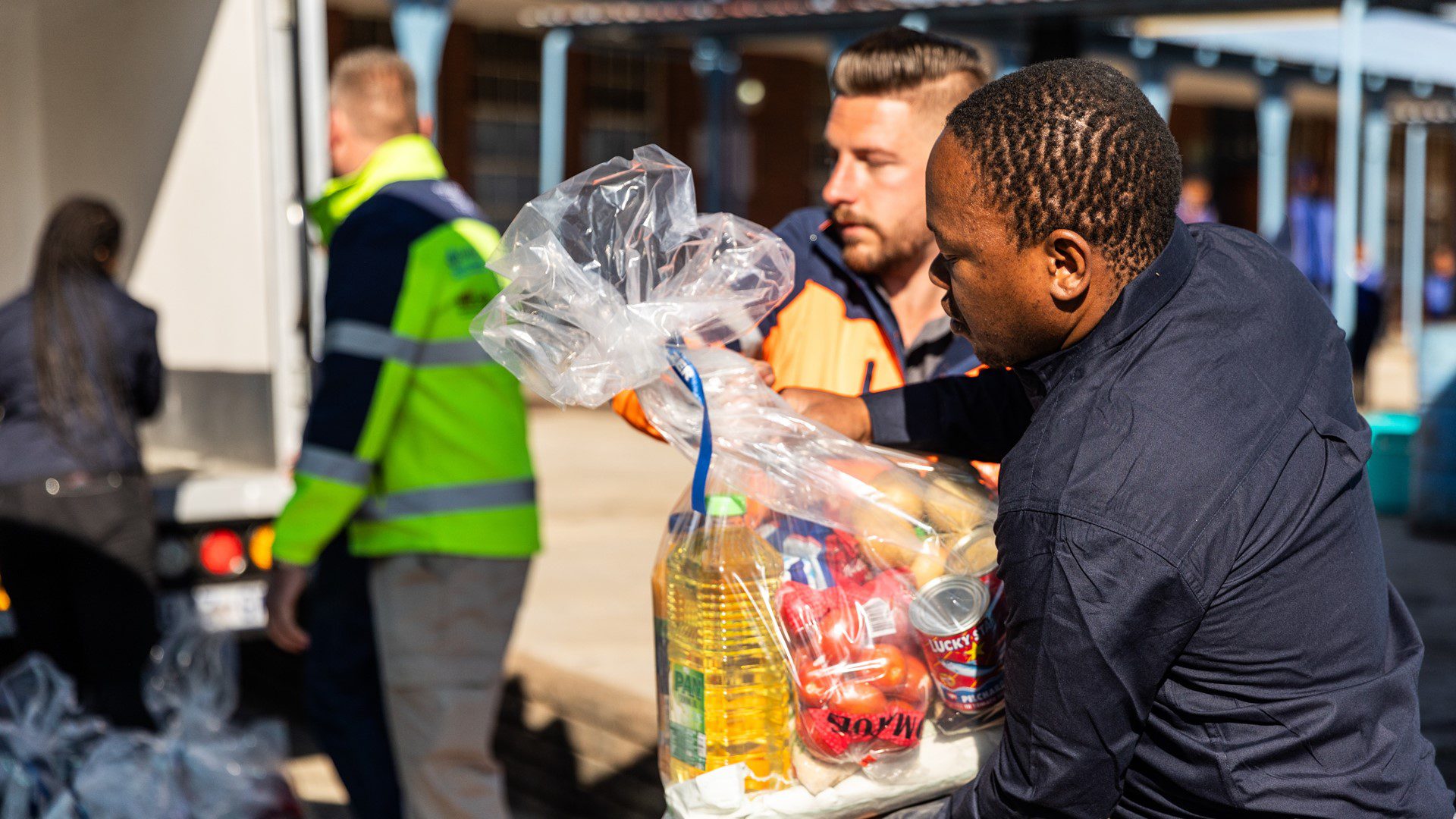 Staff loading food packages for local families