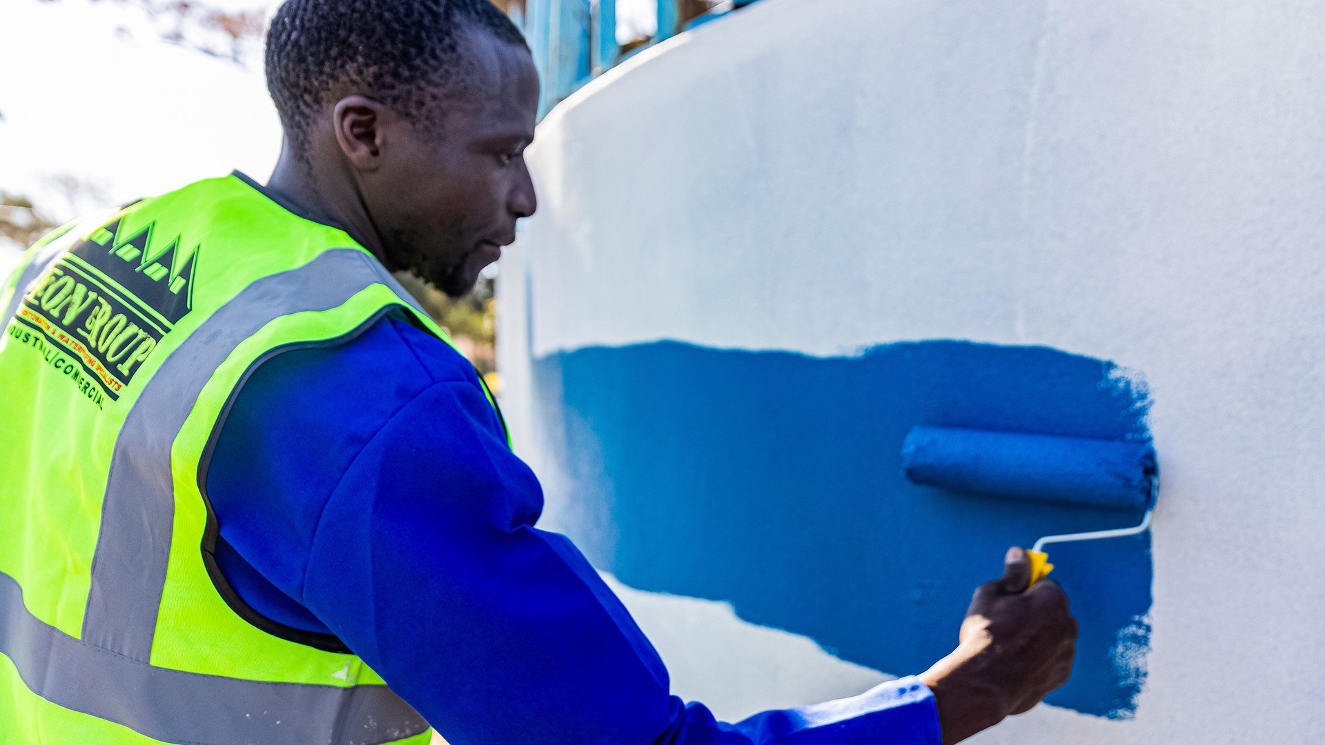 Sicon Group staff painting community infrastructure
