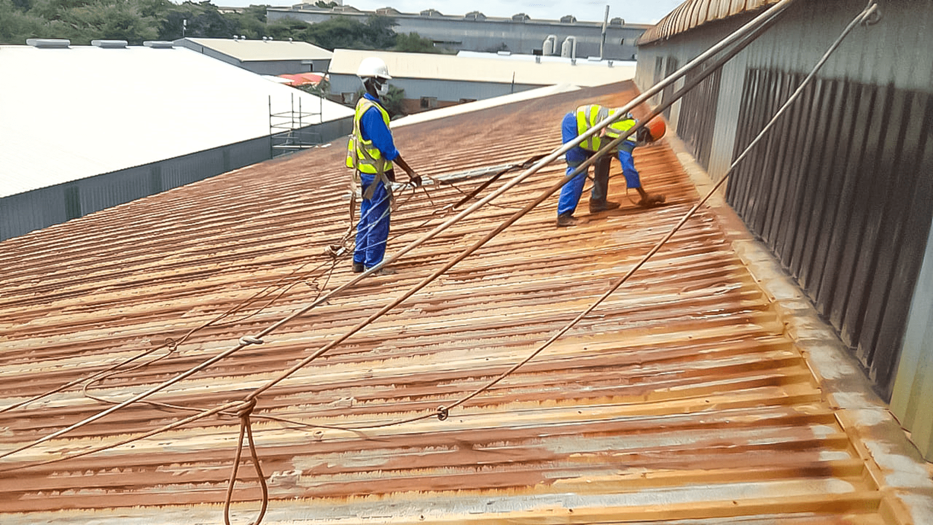 Sicon Group technicians preparing industrial roof for rust and corrosion removal application